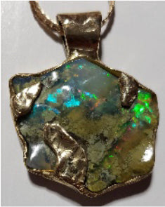 Carved opal store pendant